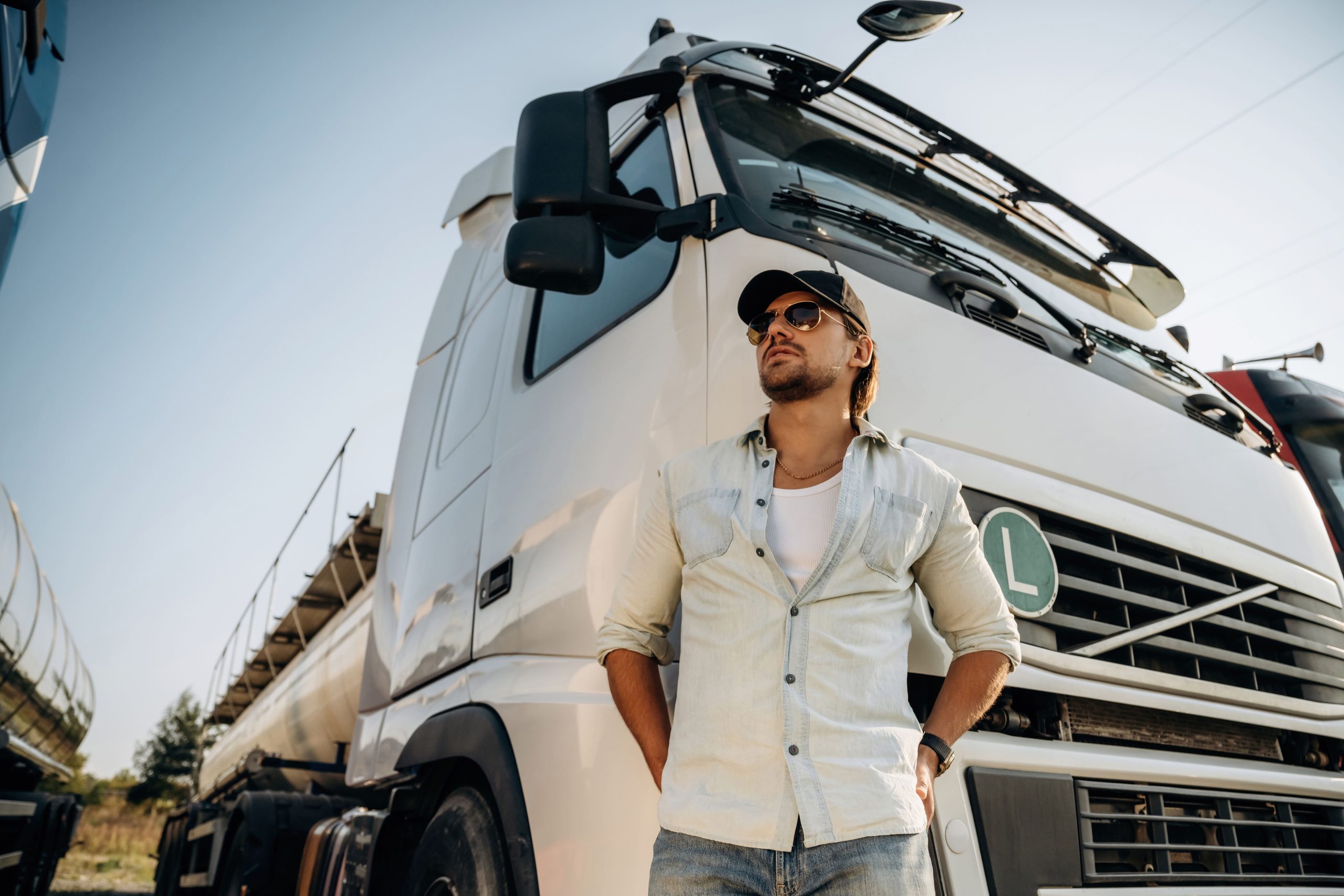 view-from-below-standing-and-posing-truck-driver-2025-03-18-21-28-19-utc